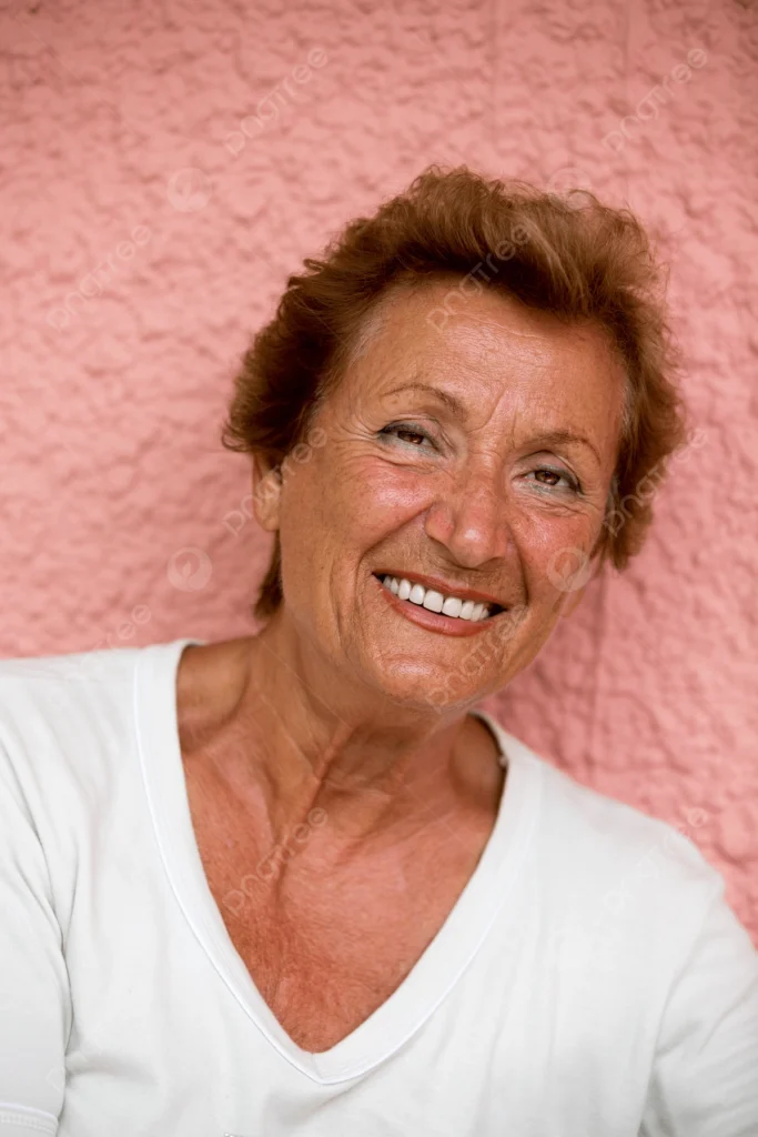 Happy elderly lady with a bright smile looking at the camera, representing enhanced wellness and optimized metabolism.